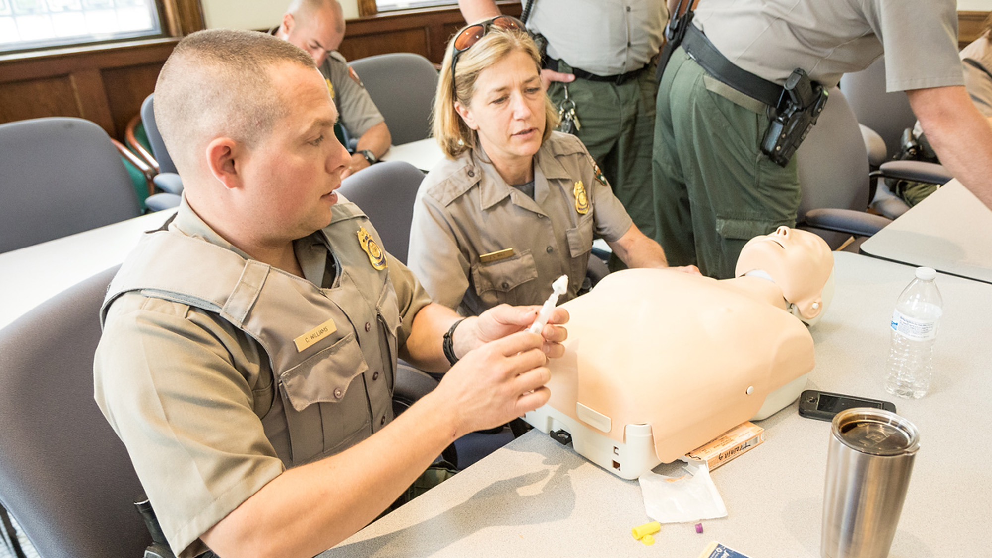 Park rangers participating in naloxone training. 