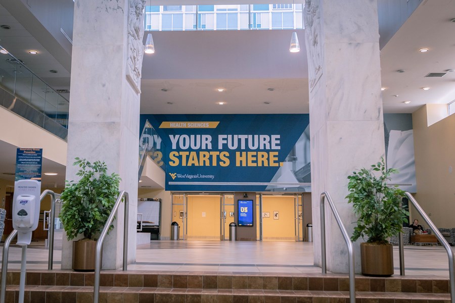 Pylons Lobby area of the Health Sciences Center, with wall signage that reads your future starts here, followed by West Virginia University logo