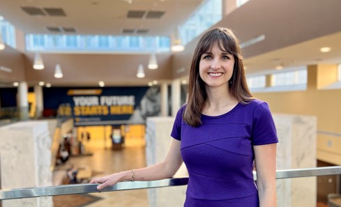 Dr. Bethany Barone Gibbs stands for a picture on the second floor of the Pylons Lobby in the WVU Health Sciences Center.