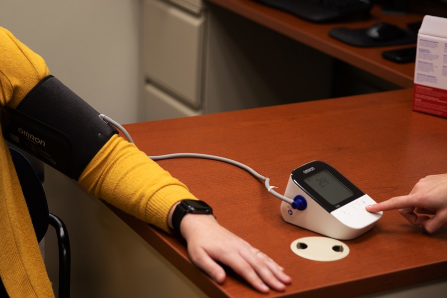 Person getting their blood pressure checked