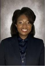 Headshot of Caitlin Mickles.